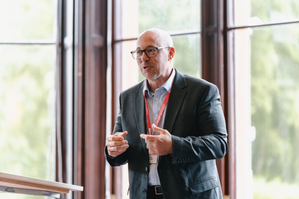 A keynote speaker addressing the conference audience