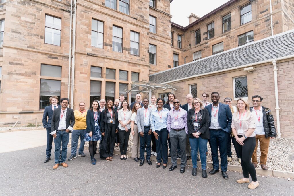 Researchers and practitioners networking at a C-MRiC event